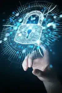 A hand reaches towards a glowing digital padlock icon, symbolizing cybersecurity. The padlock, embedded in a smart home interface, appears surrounded by light streaks and digital particles, creating a futuristic and secure ambiance.