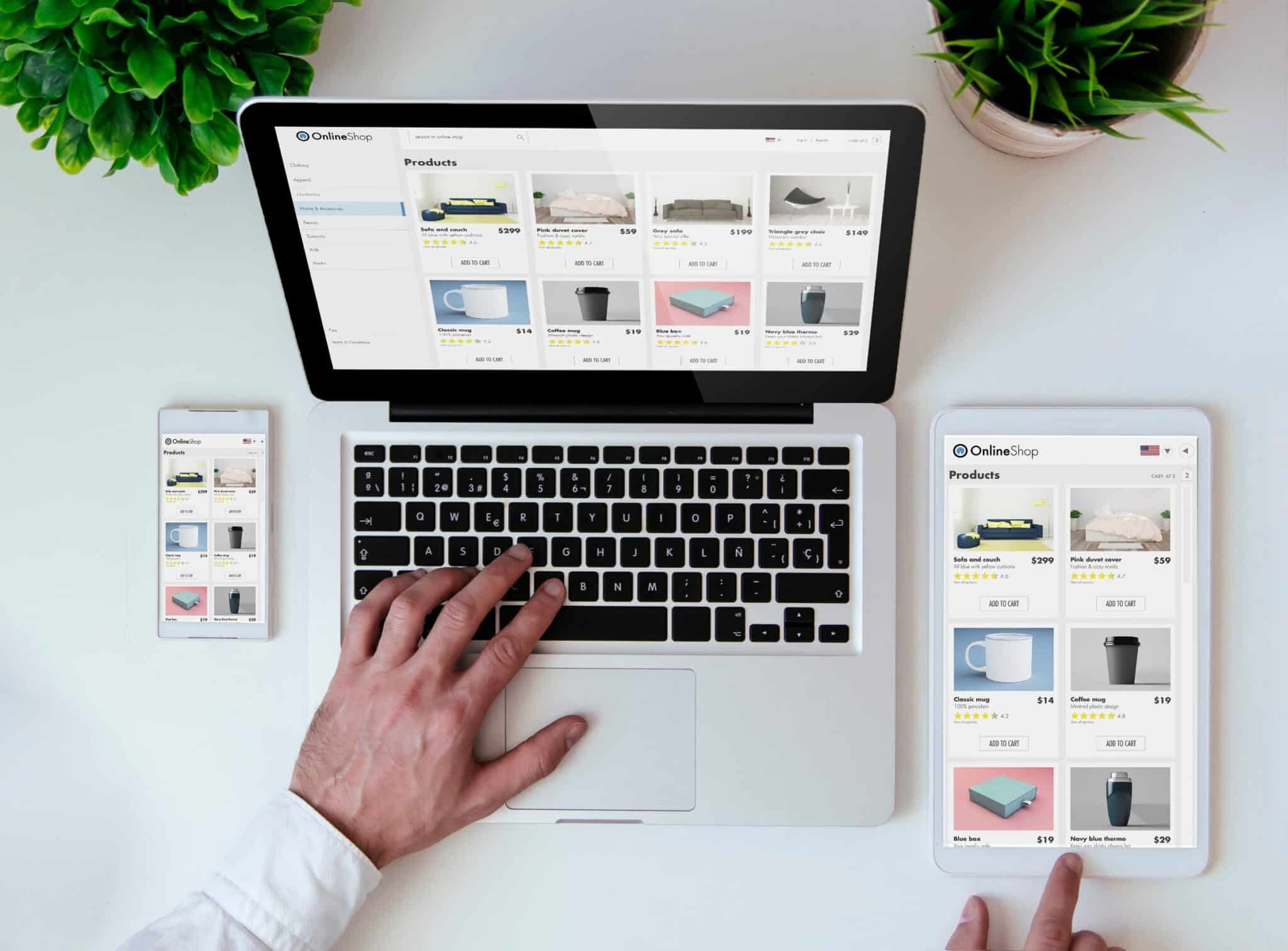 A person is using a laptop to browse an online shop, with a smartphone and tablet nearby also displaying the site. Plants are placed on both sides of the laptop, creating a serene environment for effortless shopping. The screens show various product listings, akin to an auto draft of potential purchases.