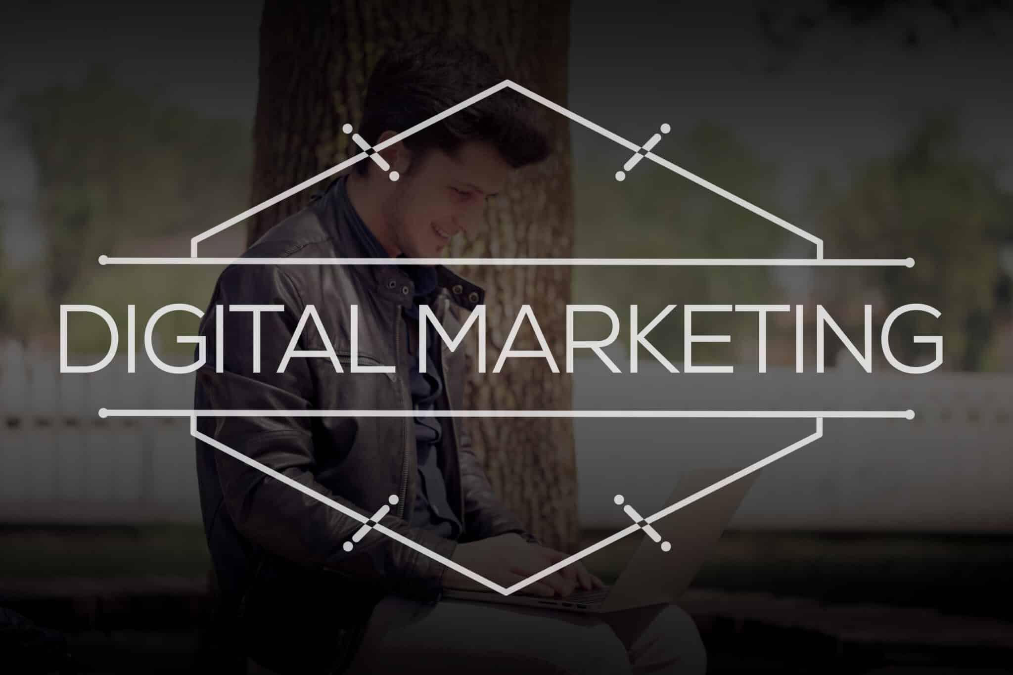 A man sits outside using a laptop, with "DIGITAL MARKETING" in bold white text and geometric lines overlaying the image—perfect for small business owners seeking online website solutions.