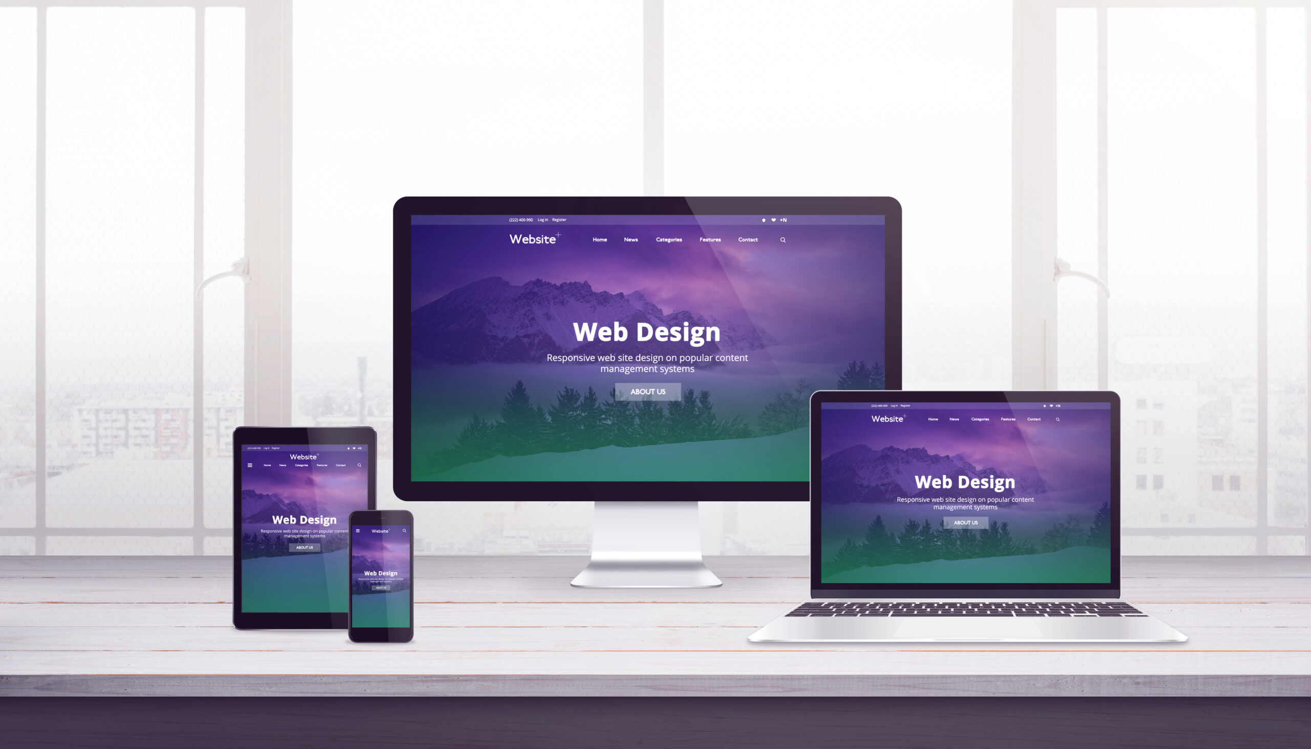 A computer monitor, laptop, tablet, and smartphone sit on a desk, each displaying the same web design homepage with a purple and green gradient background and the text 